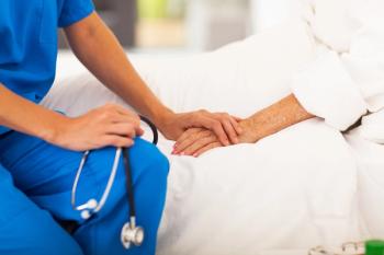 Doctor with patient in bed