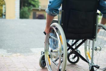Man in wheelchair | Image credit: Minerva Studio - stock.adobe.com