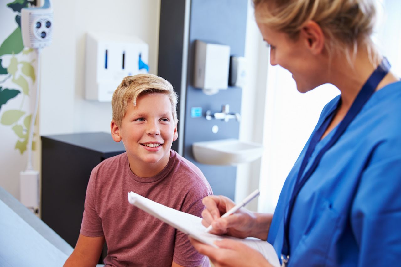 Teenage boy meeting with a doctor | Image credit: Monkey Business - stock.adobe.com