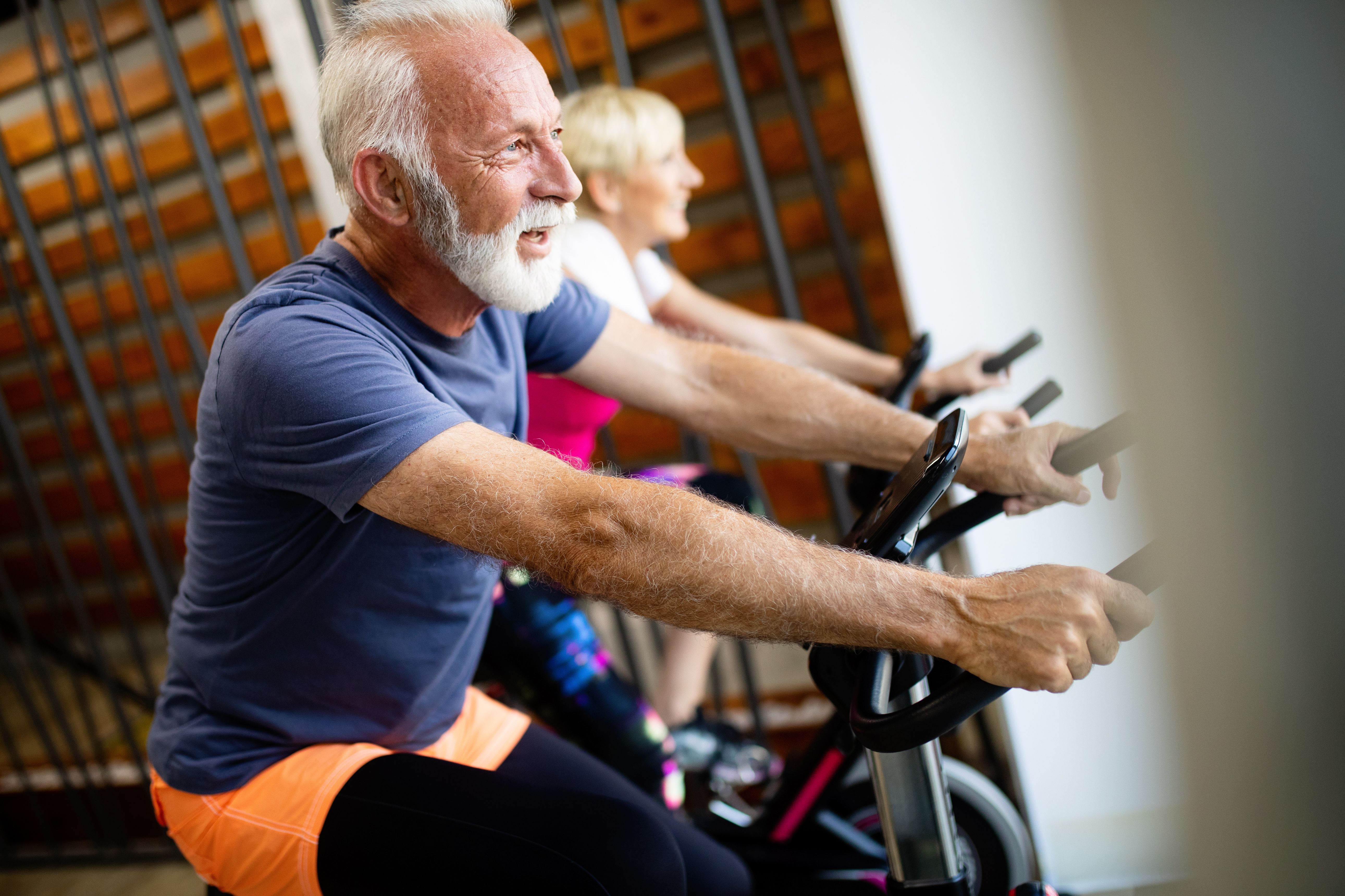 senior man on stationary bike