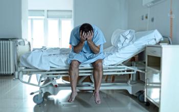 Man in Hospital Bed
