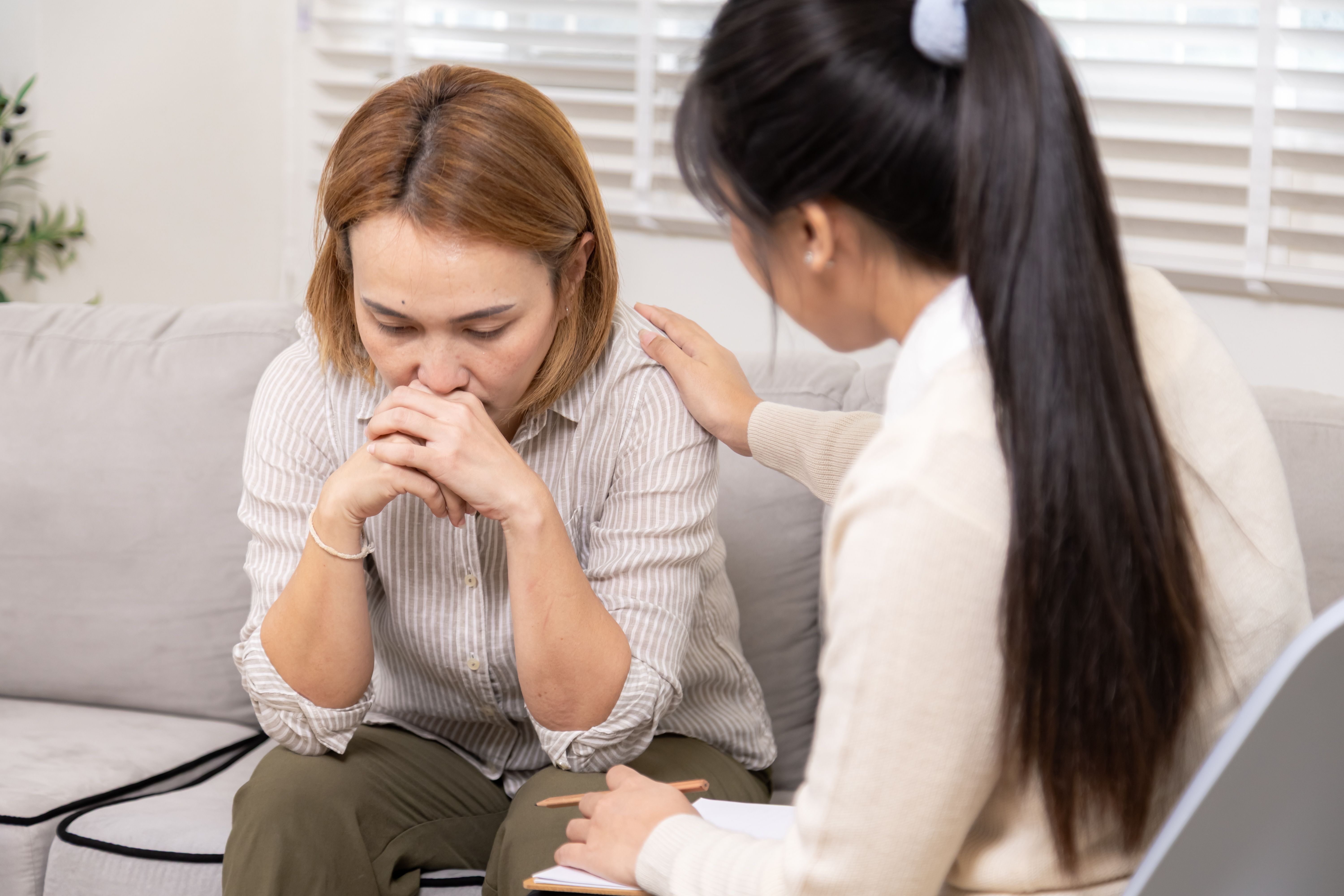 Counselor soothing traumatized patient | Image credit: Rakchanok – stock.adobe.com