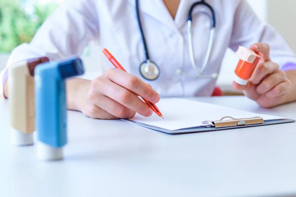 Doctor writes a script for asthma. | Image credit: @Goffkein - stock.adobe.com