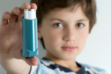 Young boy with inhaler