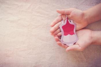 Hands holding blood, give blood donation, blood transfusion, world blood donor day, world hemophilia day concept - SewcreamStudio - stock.adobe.com