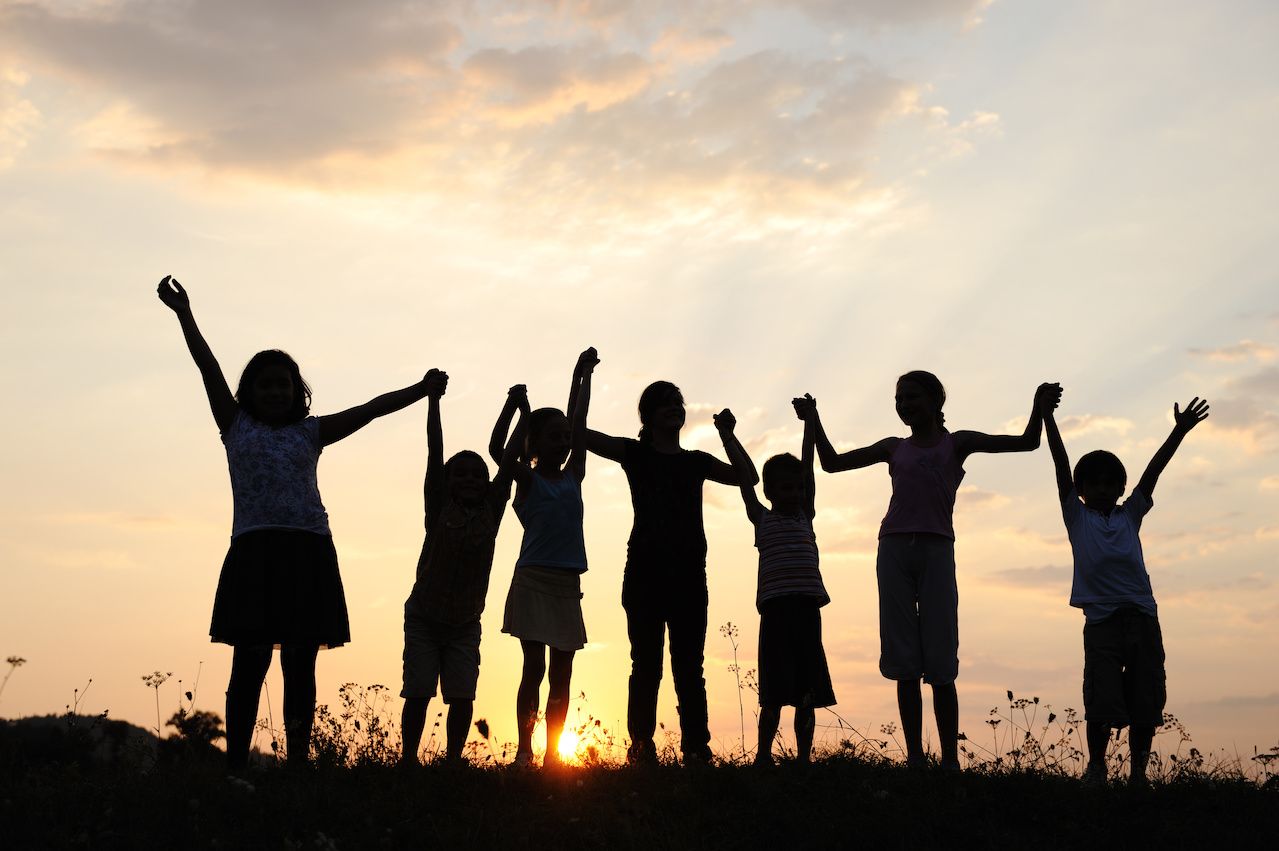 Silhouetted group of children