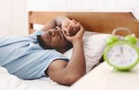 Black man with insomnia | Image Credit: © Prostock-studio-stock.adobe.com