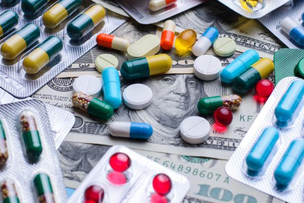 Prescription drugs on a money banknotes. Concept of healthcare costs - Vitalii - stock.adobe.com.jpeg