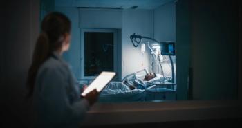 Doctor checking on sleeping patient in ICU | Image credit: Gorodenkoff – stock.adobe.com