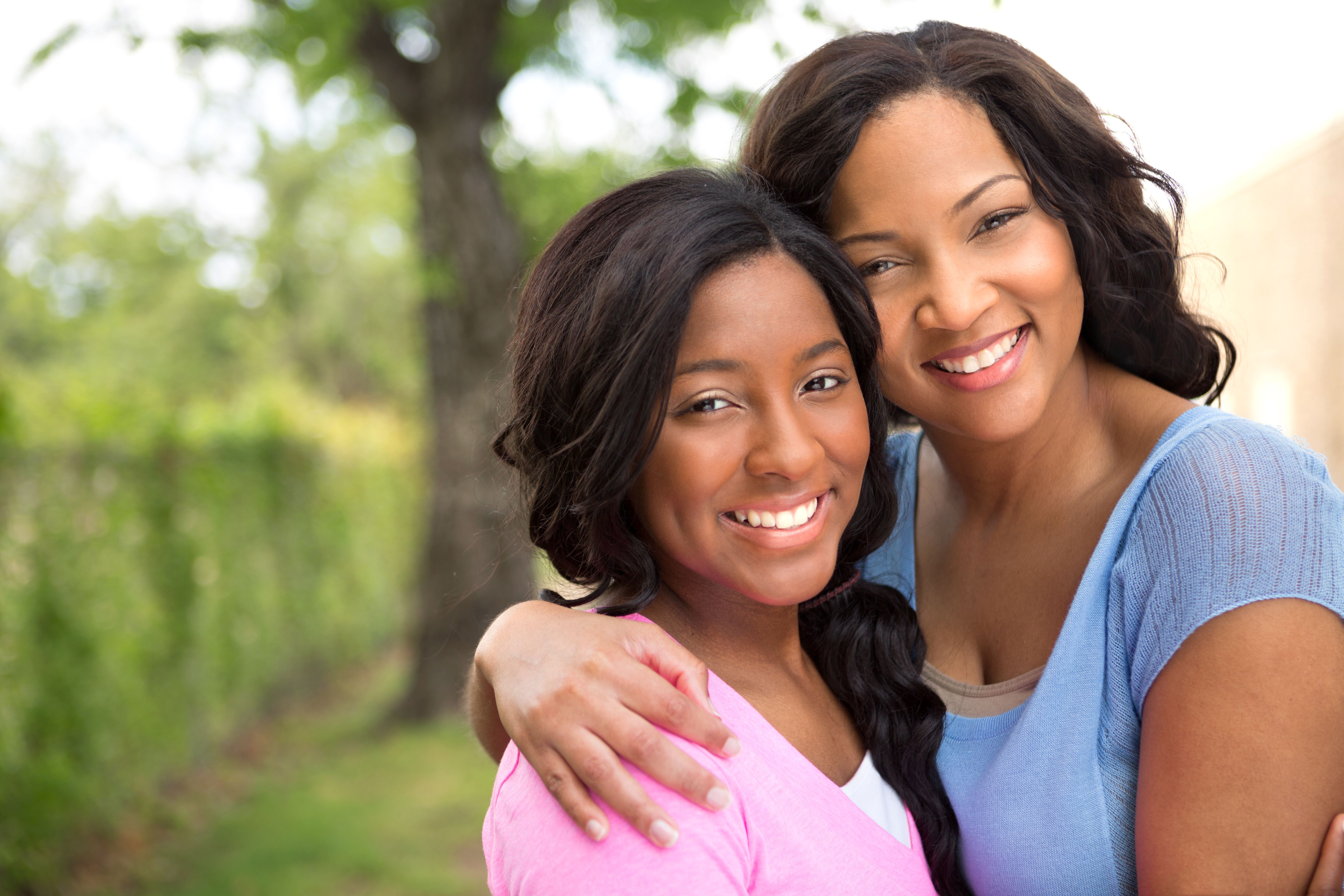 mother with arm around daughter