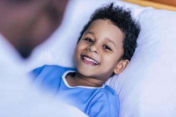 Happy child in hospital bed