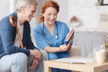 Patient with nurse at home.