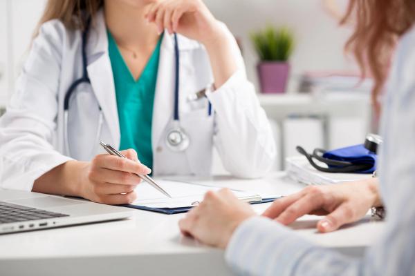 Doctor with female patient | Image credit: Liudmila Dutko - stock.adobe.com