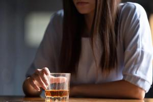 Close up of woman drinking alcohol at bar counter | Image credit: fizkes - stock.adobe.com