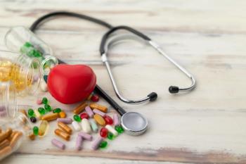 Top view of red heart and medicine on wooden floor | Image credit: Jack Fotografo - stock.adobe.com