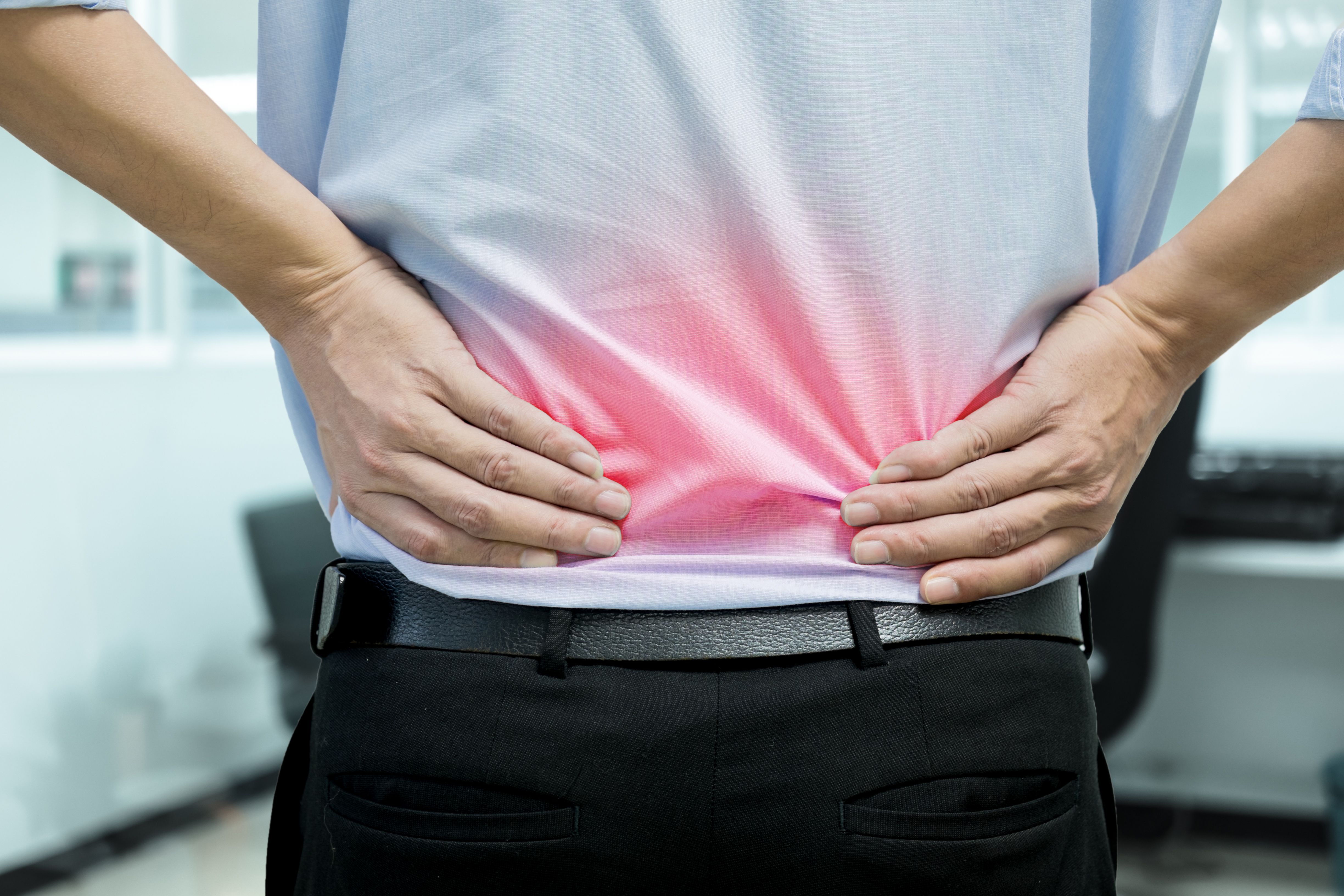 Man Feeling Back Pain | Image Credit: Mantinov - stock.adobe.com