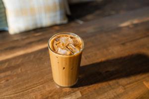 Small glass of iced coffee with ice on a table | Image credit: Wirestock - stock.adobe.com