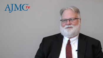 Screenshot of Scott Soefje, PharmD, BCOP, during a video interview with. the AJMCtv logo in the top corner