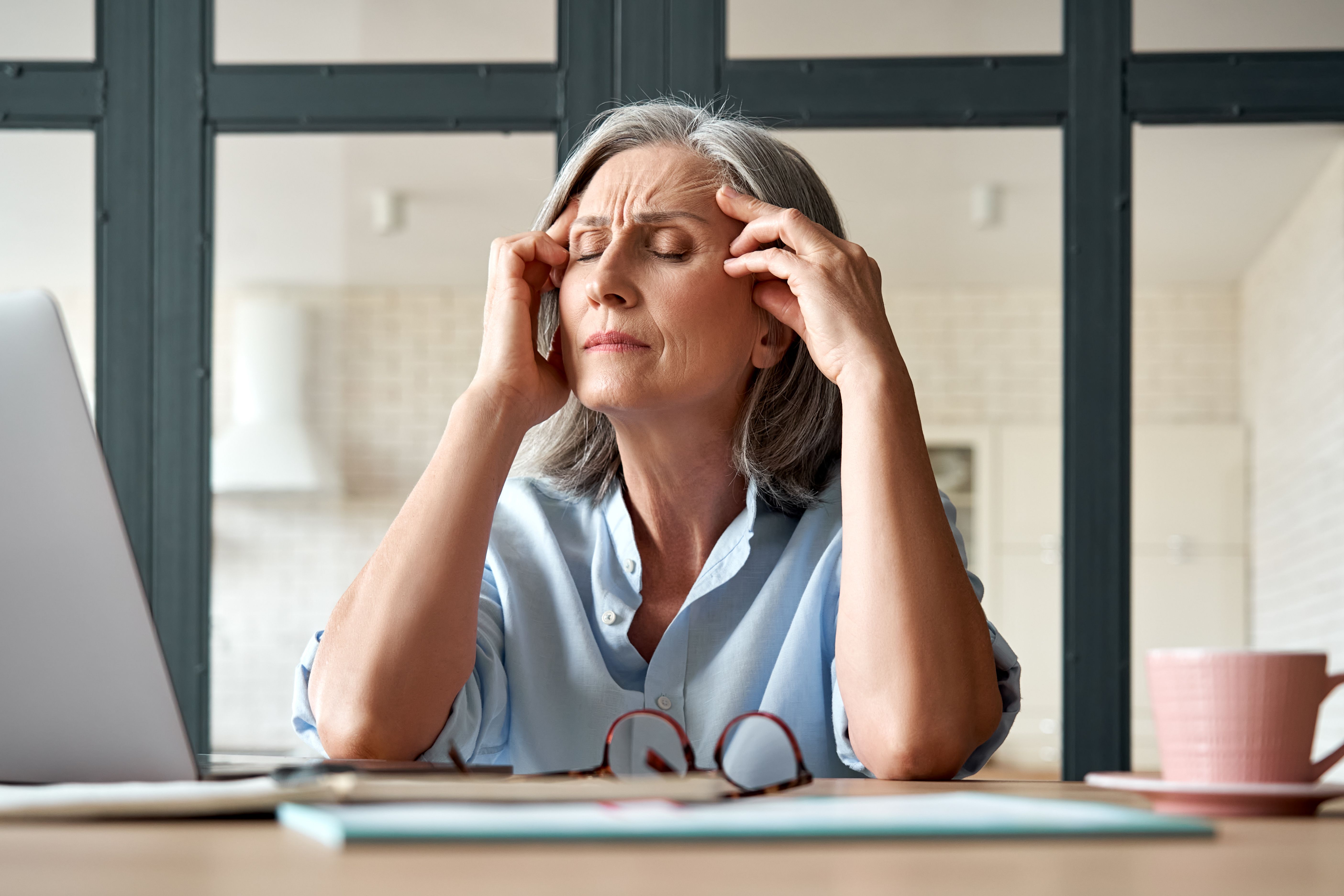 Mature woman with headache | Image credit: insta_photos – stock.adobe.com