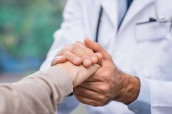 Doctor comforting patient