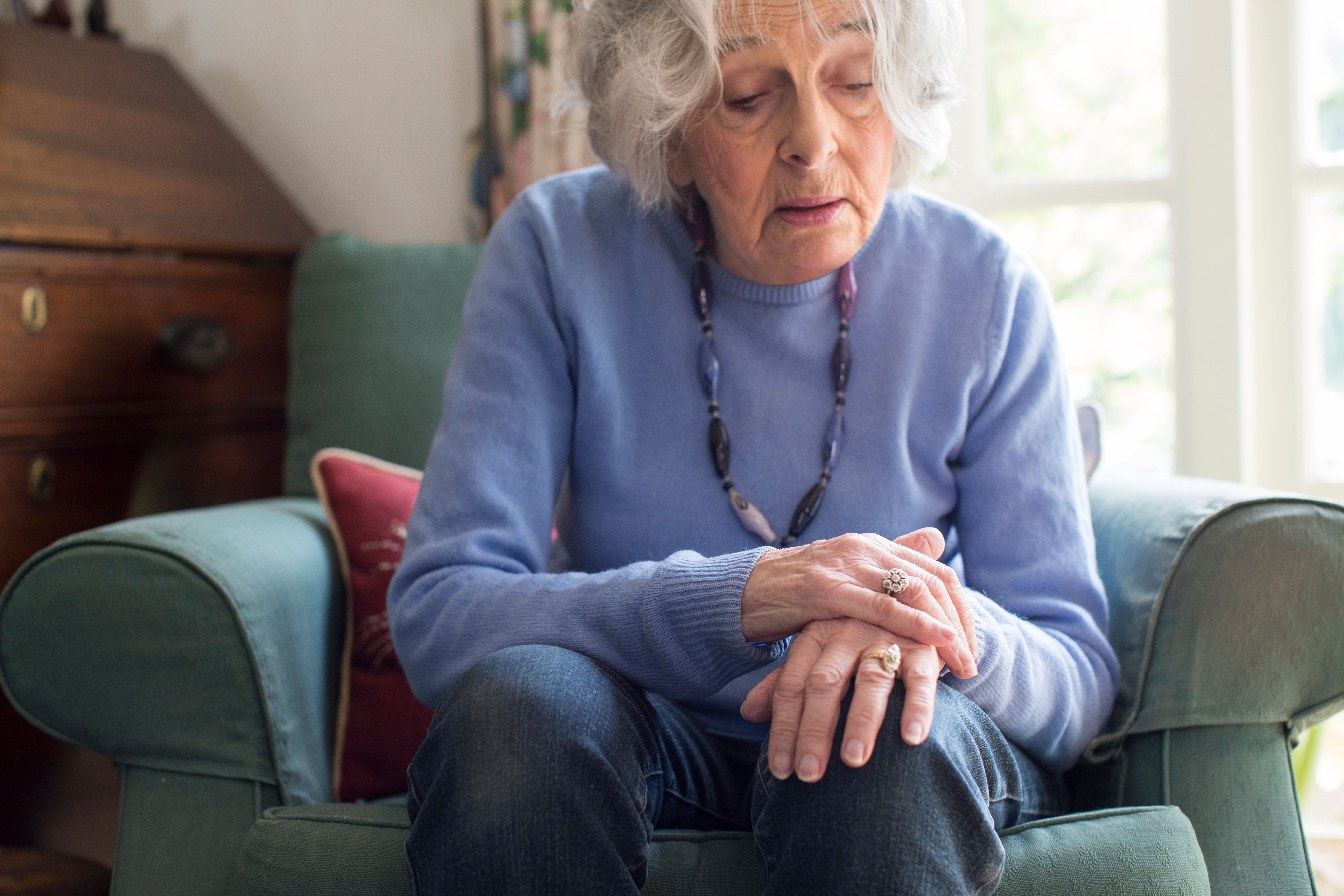 old woman sitting in chair