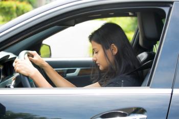 Girl dozed off behind the wheel of her car