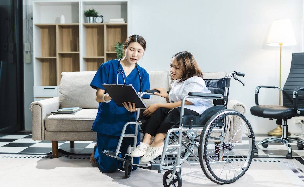 Doctor supporting disabled patient | Image Credit: © NINENII - stock.adobe.com