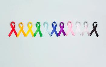 World cancer day concept, February 4. Colorful awareness ribbons on blue background. | Image Credit: WindyNight – stock.adobe.com