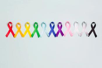 World cancer day concept, February 4. Colorful awareness ribbons on blue background. | Image Credit: WindyNight – stock.adobe.com