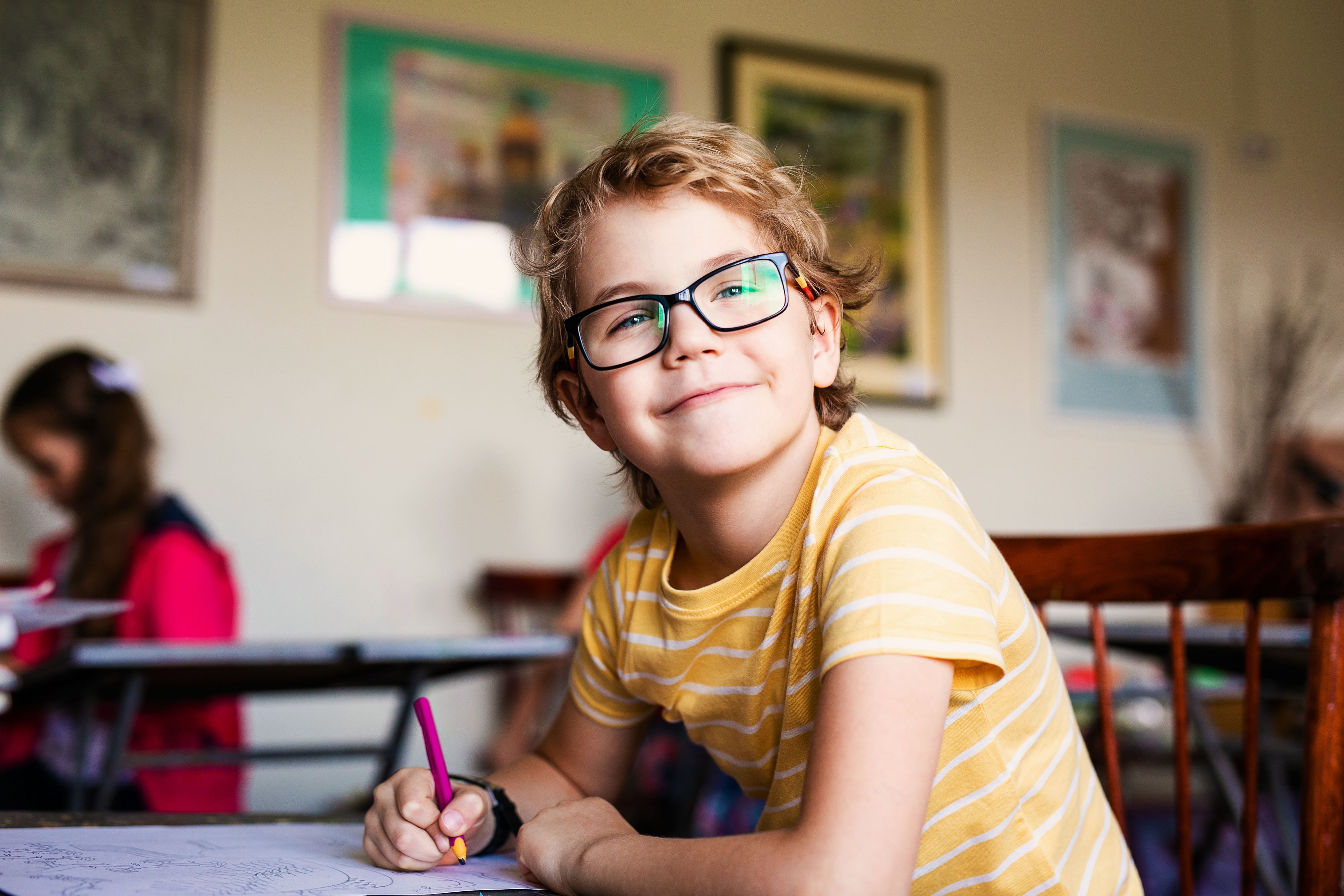 Child with glasses in classroom | Image credit: Lena May - stock.adobe.com