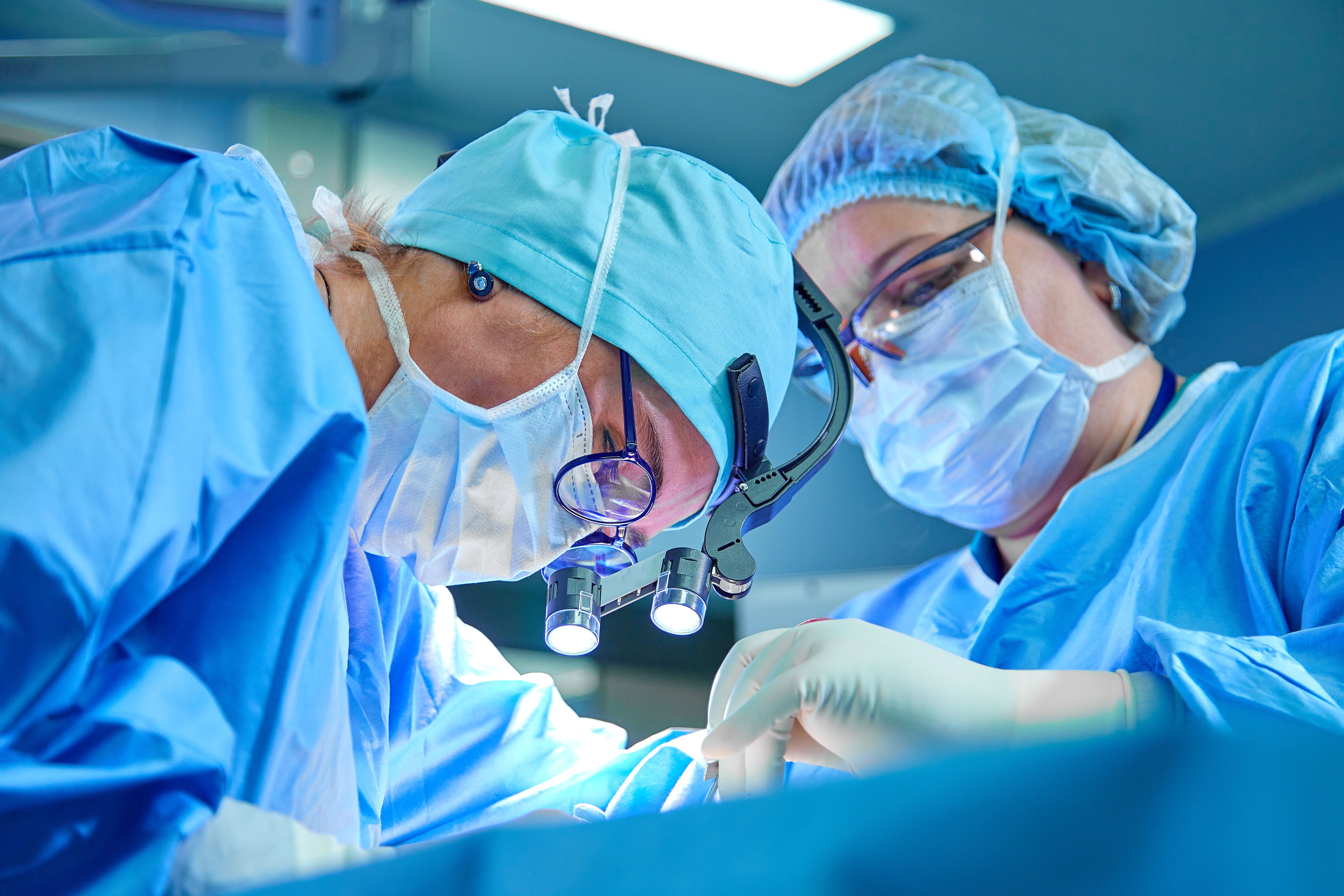 Surgeon team performing an operation | Image Credit: Georgii - stock.adobe.com