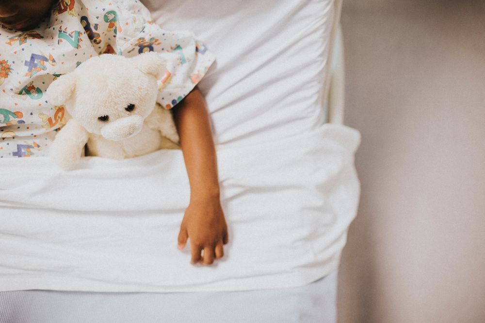 child in hospital bed