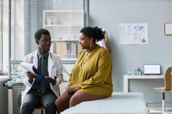 Black patient speaking with doctor | Image credit: Seventyfour - stock.adobe.com