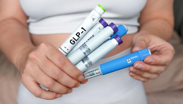 Woman holding GLP-1 injections | Image credit: Kateryna - stock.adobe.com