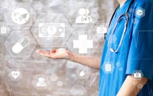 Doctor pushing button dollar virtual healthcare in network medicine | Image Credit: © maxsim - stock.adobe.com