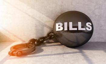 Shackled with bills | Image Credit: petrovk - stock.adobe.com