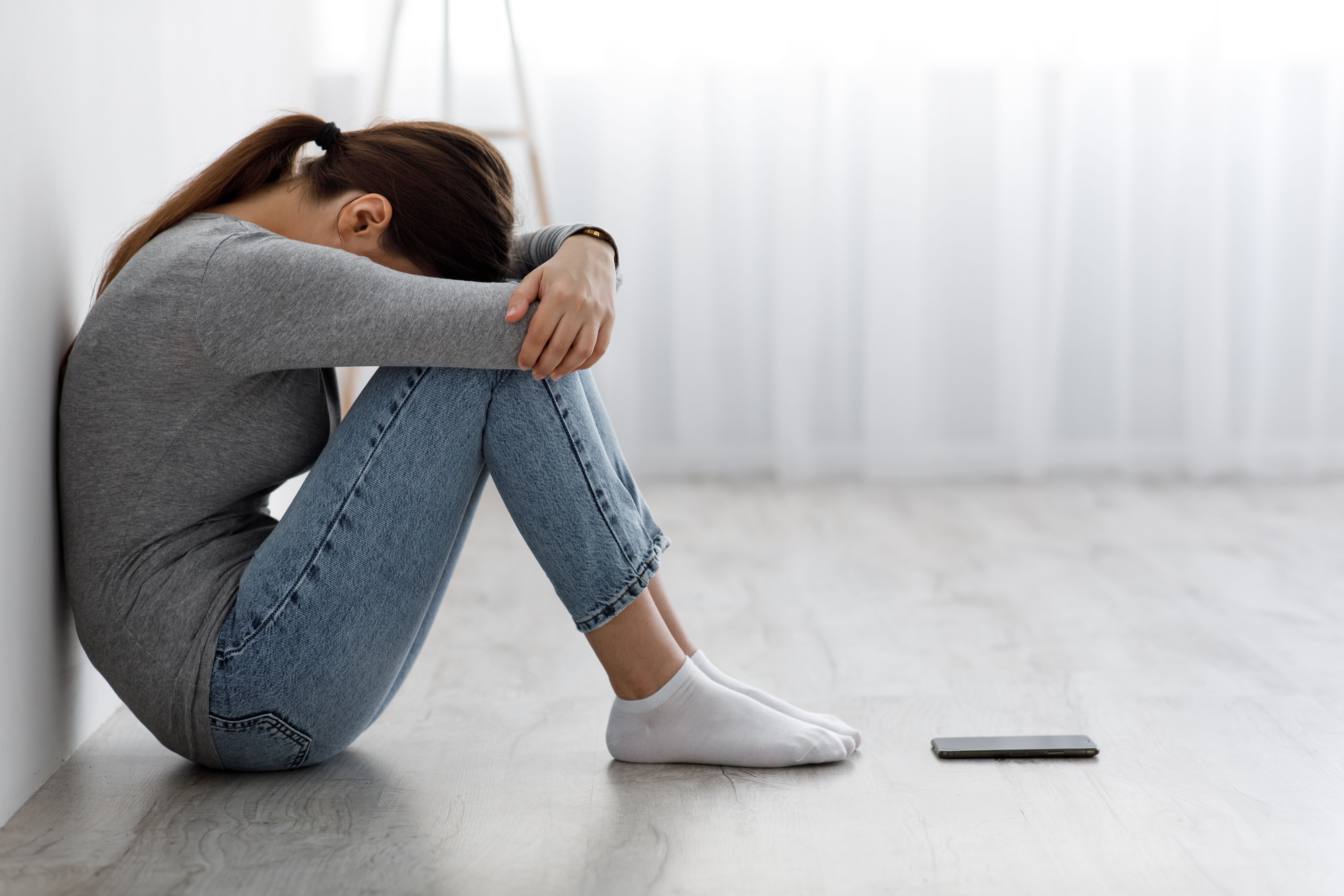 Sad unhappy depressed millenial | Image credit: Prostock-studio - stock.adobe.com