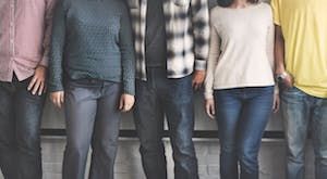 Five women and men standing in a line