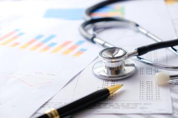 medical documents, stethoscope, and pen