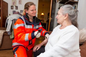 Paramedic measures woman's blood pressure | Image credit: Katja – stock.adobe.com