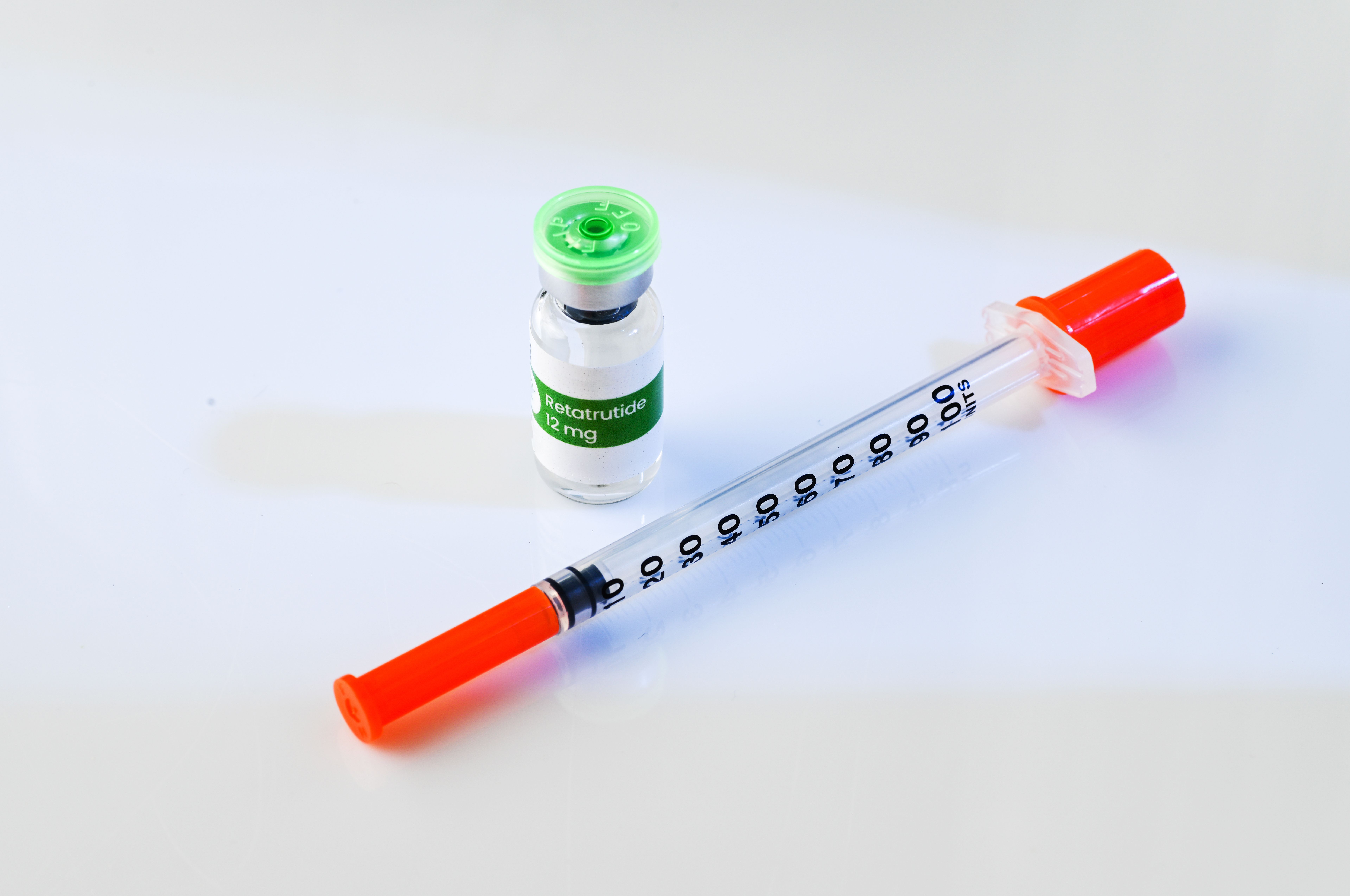 Retatrutide injection pen — Eli Lilly's investigational triple agonist GLP-1 drug | Image credit: Anna Hoychuk - stock.adobe.com