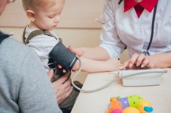 Doctor taking child's blood pressure | Image credit: romaset – stock.adobe.com