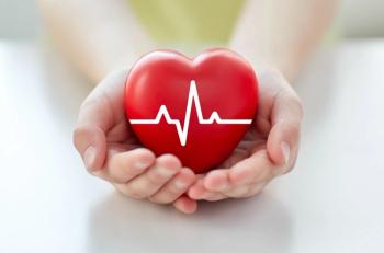 Closeup of hand with cardiogram on red heart | Image Credit: Syda Productions - stock.adobe.com