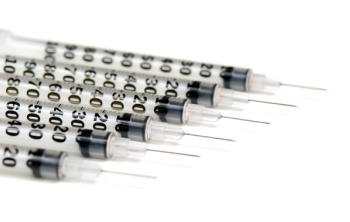 6 syringes lined up next to one another