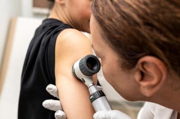 Dermatologist examining skin | Image credit: Medical Works – stock.adobe.com