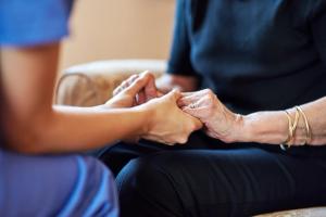 Nurse holding older woman's hands - Cecilie Arcurs/peopleimages.com - stock.adobe.com.jpeg