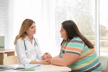 doctor talking to overweight patient | image credit: New Africa - stock.adobe.com