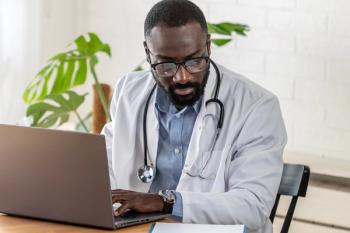 Doctor works on laptop | Image Credit: © lordn - stock.adobe.com
