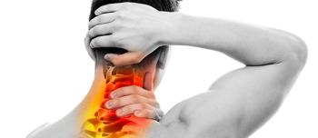 man grabbing at head and neck in pain