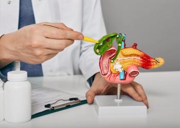 Doctor pointing to model gallbladder | Image credit: Peakstock – stock.adobe.com